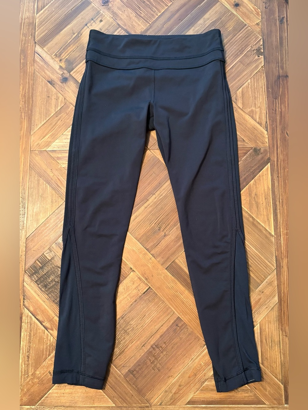 Lululemon Black Leggings with side seam and lower leg mesh 4